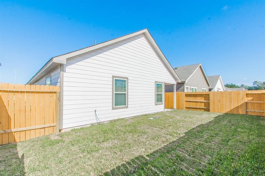 Enjoy your private outdoor escape with this lush, fenced backyard. With enough space for gatherings, games, or quiet moments, this yard is ideal for creating memorable experiences. A blank canvas for your landscaping dreams!