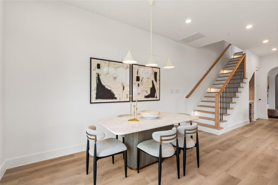 Positioned right at the base of the staircase, this dining space naturally bridges the kitchen and the rest of the first floor. It's sized for real family dinners, not just a token table.