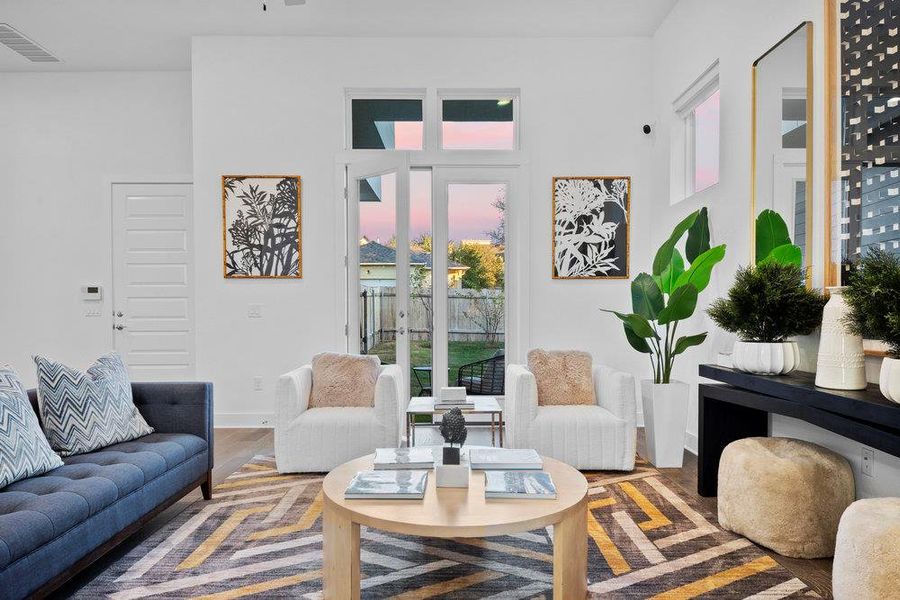 Living room featuring healthy amount of natural light and wood finished floors