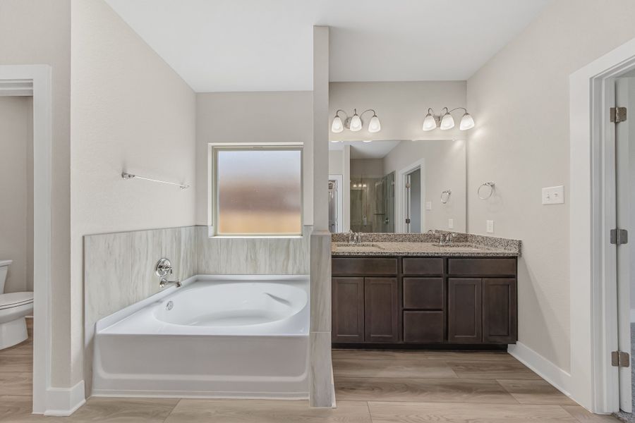 Representative furnished interior of a home built from the Newport by Omega Builders in Southern Pointe, College Station (Image 11).