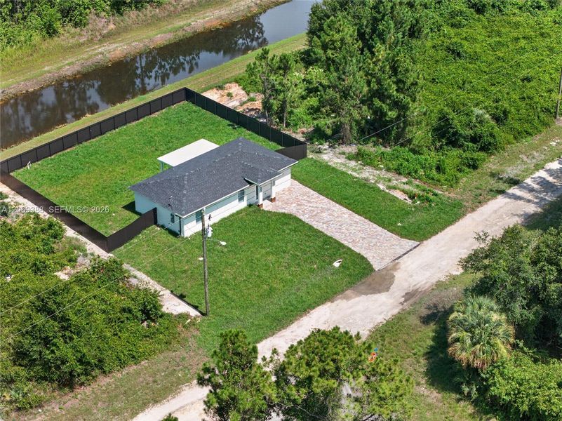 Front exterior of a new home in , Lehigh Acres, FL, highlighting curb appeal (Image 18).