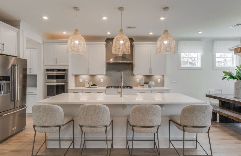Open Kitchen Space with an island with plenty of space for additional seating.