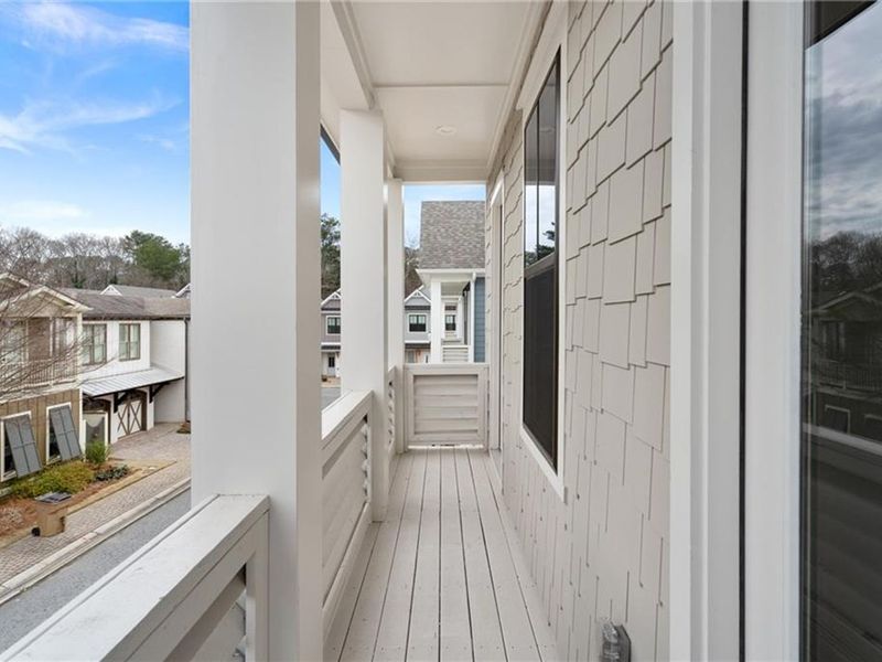 Exterior details and patio area of a home in The Village at Towne Lake, Woodstock (Image 31).