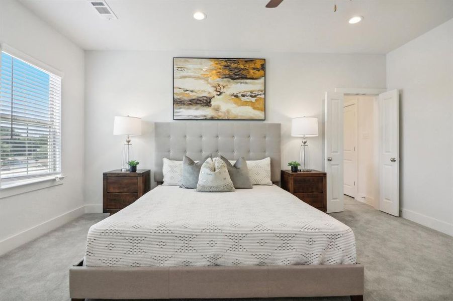 Bedroom featuring carpet flooring and ceiling fan