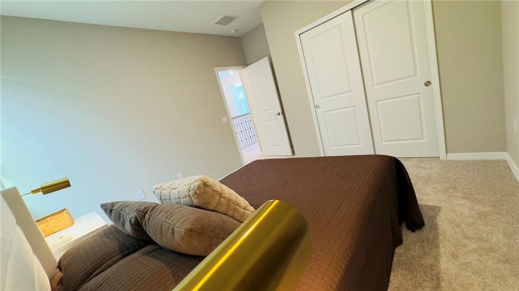 Furnished interior view inside a new home in Harvest at Ovation, Winter Garden (Image 59).