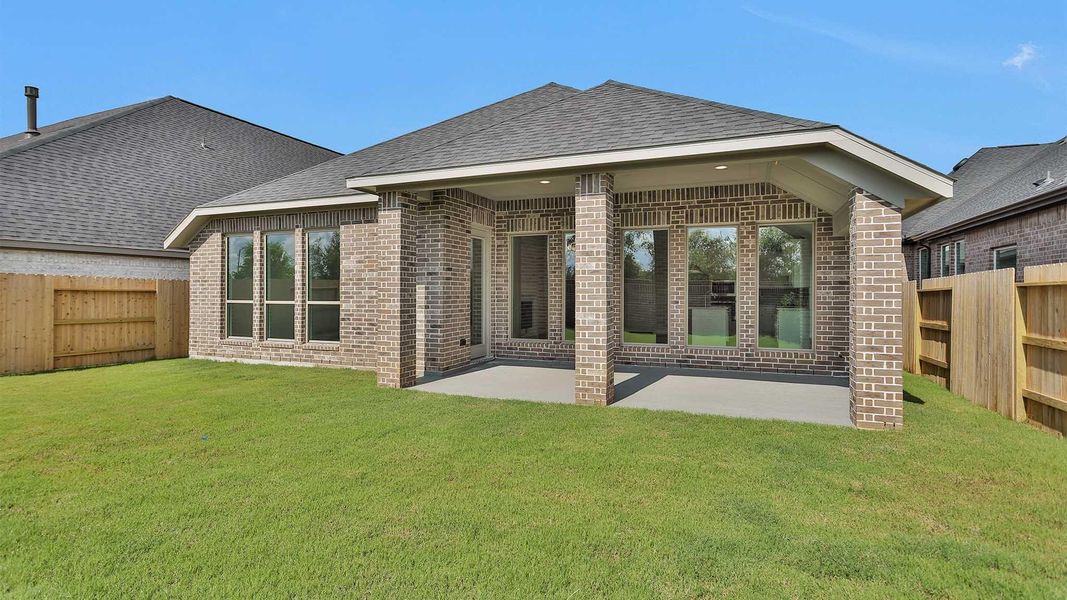 Front exterior of a new home in Grange 50', Katy, TX, highlighting curb appeal (Image 2). Front exterior of a new home in Grange 50', Katy, TX, highlighting curb appeal (Image 2).