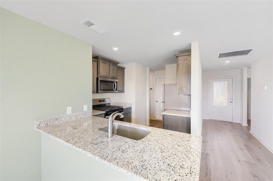 Furnished interior view inside a new home in Patriot Estates, Venus (Image 10).