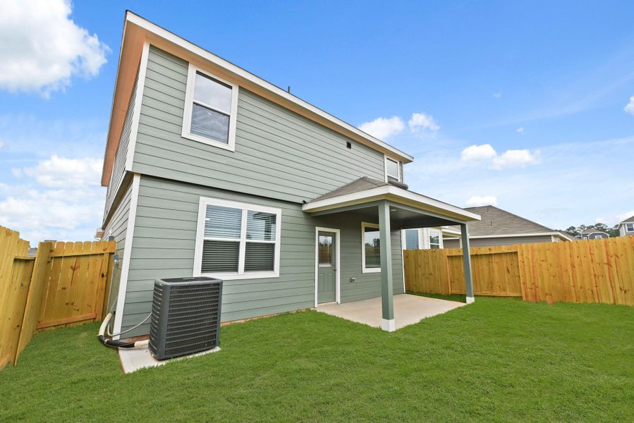Front exterior of a new home in Ridgeland Hills, Willis, TX, highlighting curb appeal (Image 2). Front exterior of a new home in Ridgeland Hills, Willis, TX, highlighting curb appeal (Image 2).