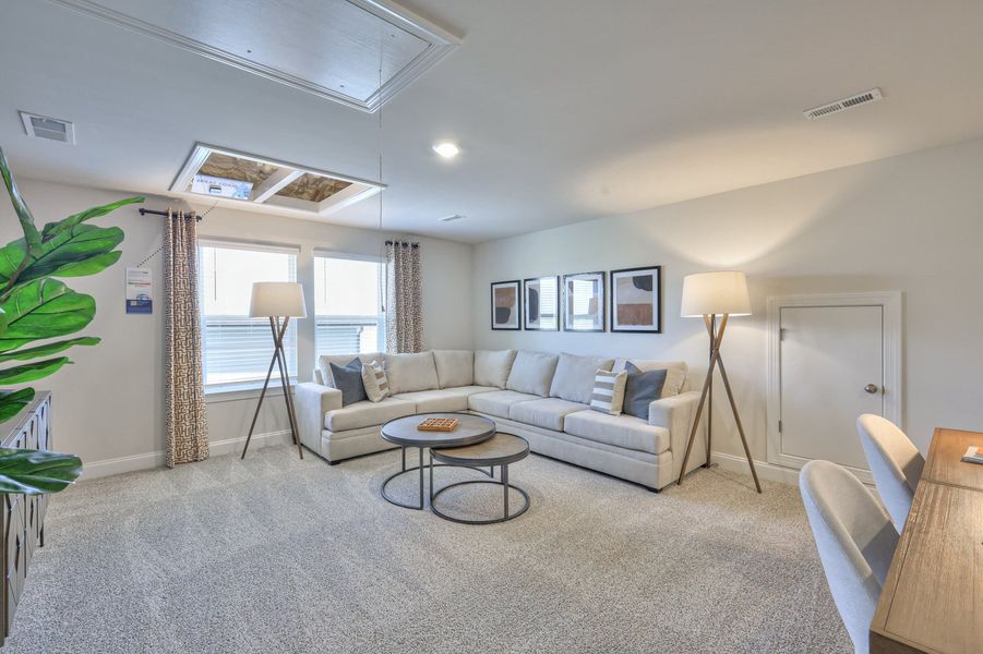 The upstairs loft separates the secondary bedrooms.