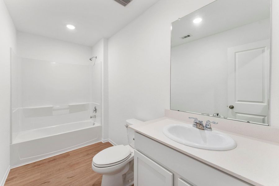 The two secondary bedrooms share this bathroom.