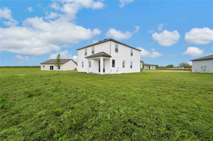 Exterior details and patio area of a home in Citrus Place, Babson Park (Image 3).