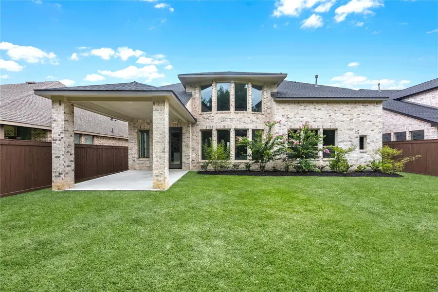 Front exterior of a new home in The Trails - 60', New Caney, TX, highlighting curb appeal (Image 1).