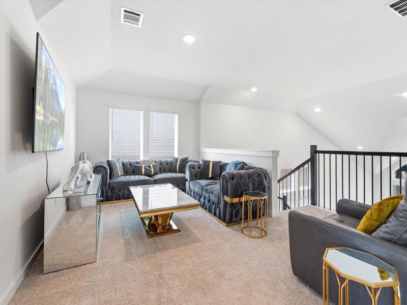 Cozy game room at the top of the stairs with plenty of room for seating or a game table. Cozy game room at the top of the stairs with plenty of room for seating or a game table.