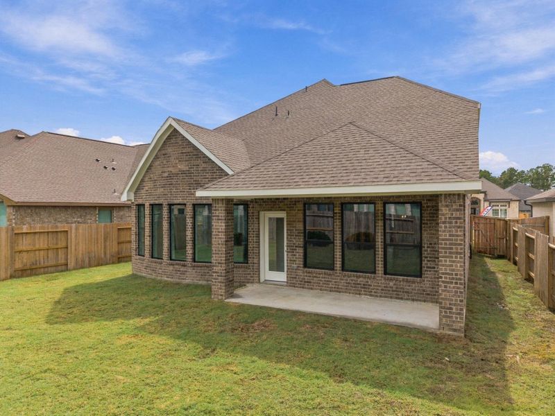 Exterior details and patio area of a home in The Trails, New Caney (Image 4).