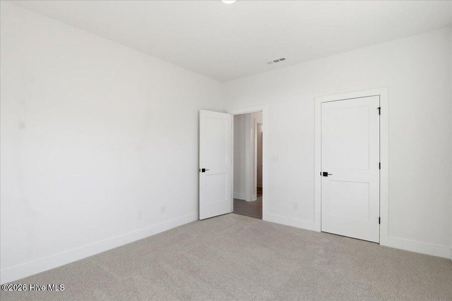 Spacious, unfurnished interior of a new home in Wood Creek, Leland (Image 22).