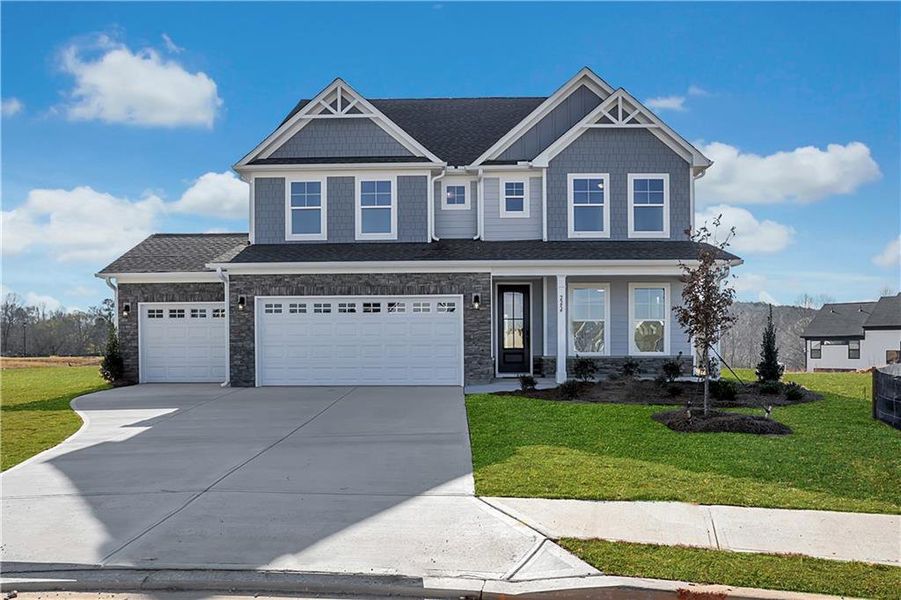 Front exterior of a new home in Twin Lakes, Hoschton, GA, highlighting curb appeal (Image 30).