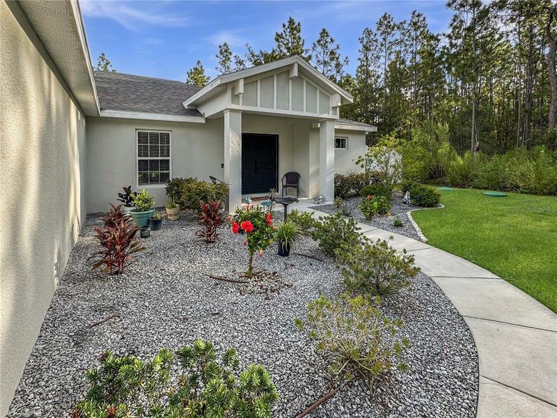 Front exterior of a new home in , Weeki Wachee, FL, highlighting curb appeal (Image 27).