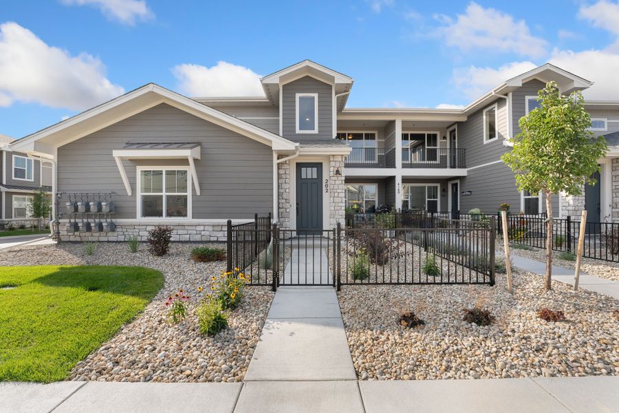 Front exterior of a new home in The Lakes at Centerra, Loveland, CO, highlighting curb appeal (Image 15).