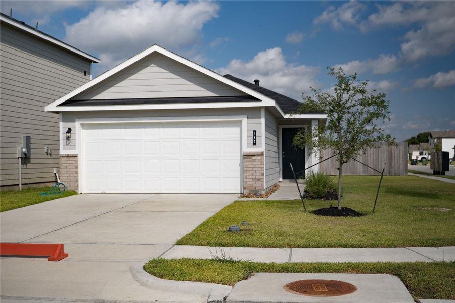 Front exterior of a new home in , Dayton, TX, highlighting curb appeal (Image 3).
