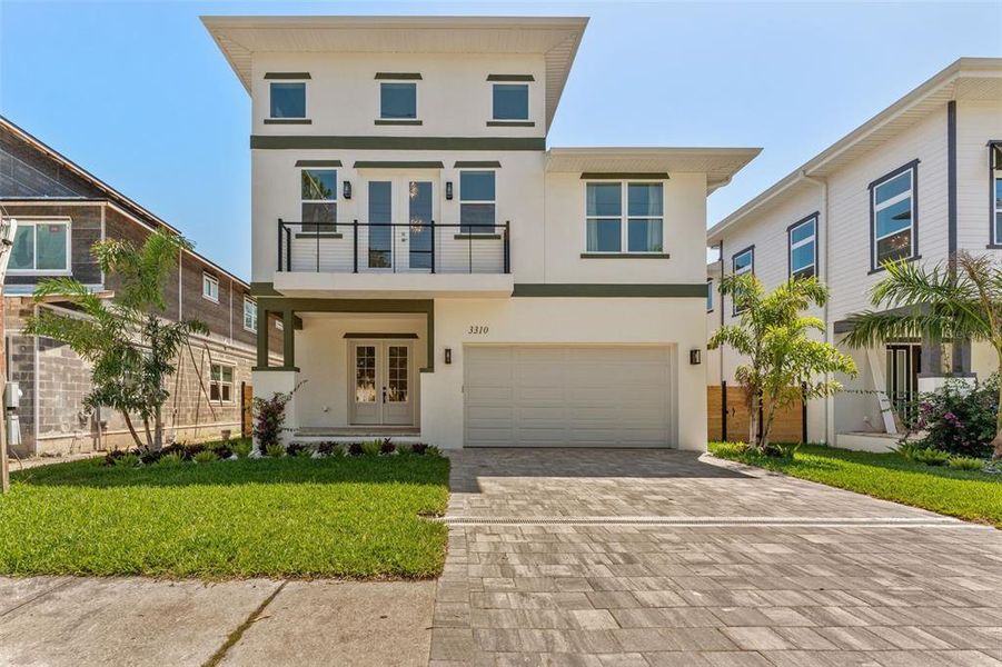 Front exterior of a new home in Wyoming Estates, Tampa, FL, highlighting curb appeal (Image 2). Front exterior of a new home in Wyoming Estates, Tampa, FL, highlighting curb appeal (Image 2).