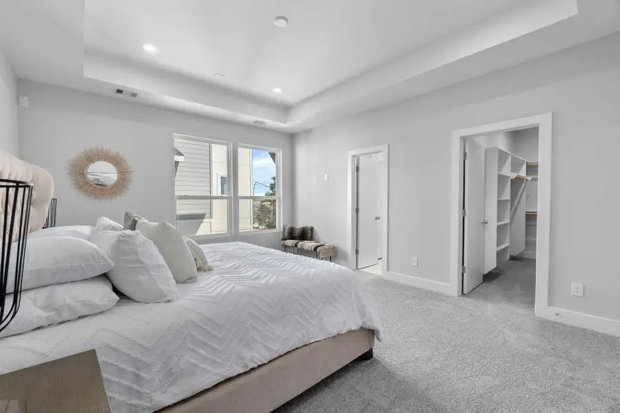 Private retreat with ample space for a seating area, complemented by direct access to the en-suite bath and walk-in closet.