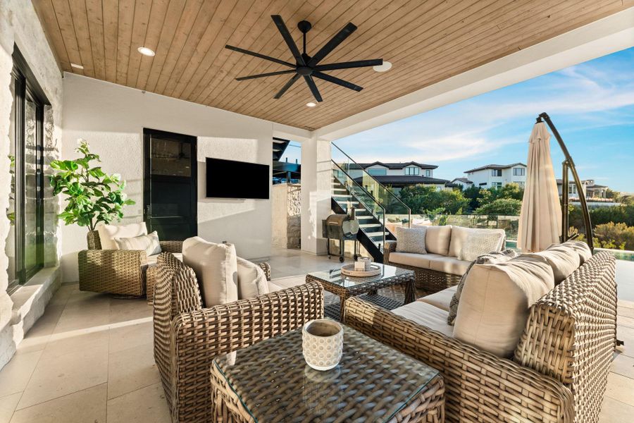 View of patio / terrace with a ceiling fan and an outdoor hangout area View of patio / terrace with a ceiling fan and an outdoor hangout area