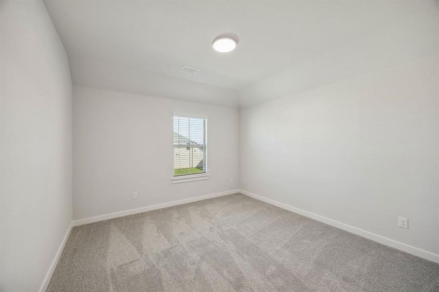 Bedroom in the Wimbledon home plan by Trophy Signature Homes – REPRESENTATIVE PHOTO