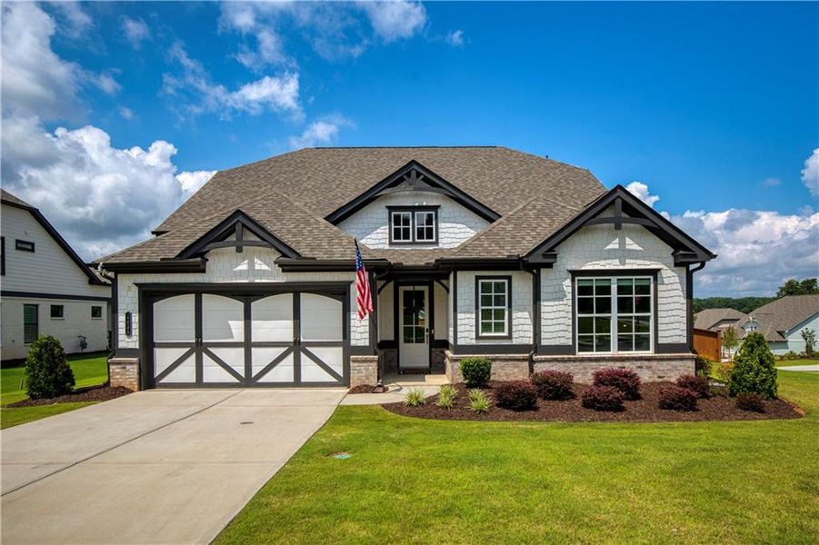 Front exterior of a new home in Yellowstone Farms, Cumming, GA, highlighting curb appeal (Image 25). Front exterior of a new home in Yellowstone Farms, Cumming, GA, highlighting curb appeal (Image 25).