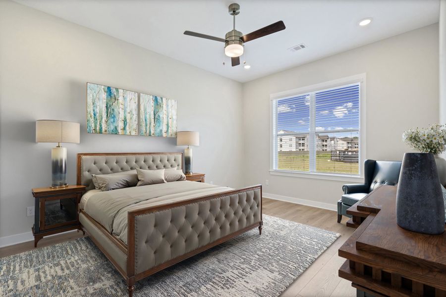 Room featuring light wood-finish flooring, a ceiling fan with integrated lighting, and recessed ceiling lights Room featuring light wood-finish flooring, a ceiling fan with integrated lighting, and recessed ceiling lights