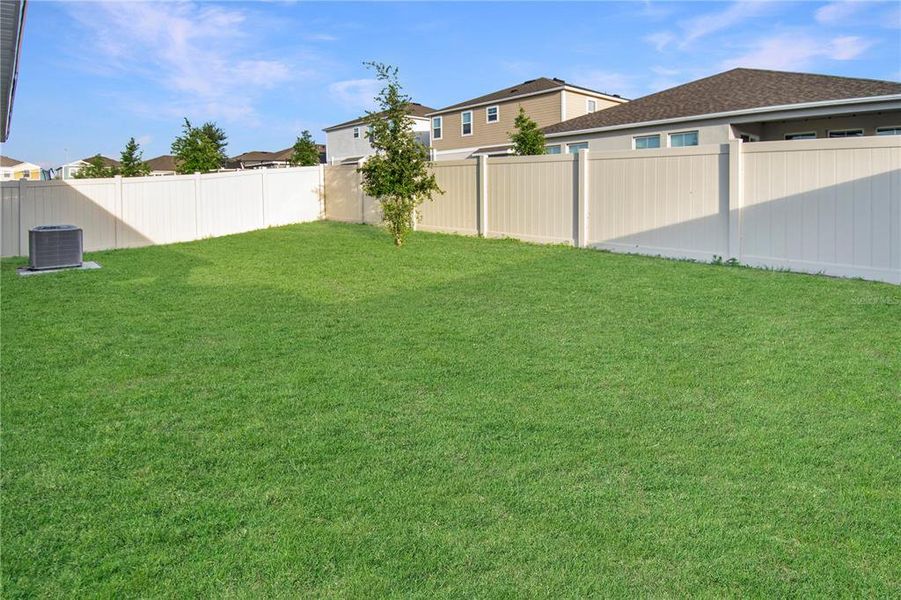 Exterior details and patio area of a home in Forest Lake, Davenport (Image 27).