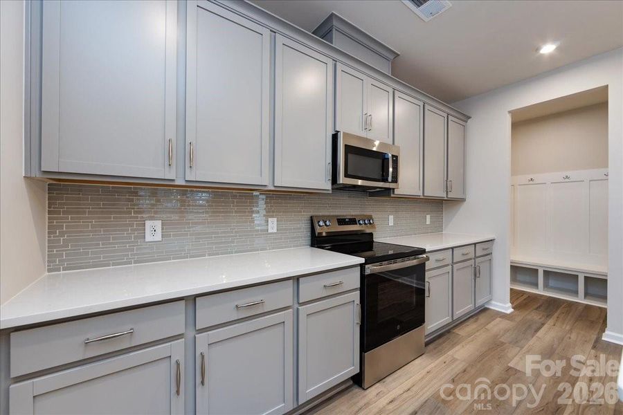 GE 30" Free-Standing Electric Range Appliance Package with Microwave Hood in Stainless Steel