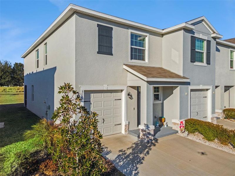 Front exterior of a new home in , Plant City, FL, highlighting curb appeal (Image 1). Front exterior of a new home in , Plant City, FL, highlighting curb appeal (Image 1).