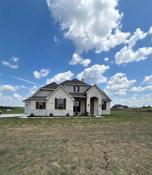 View of front of property with a front yard