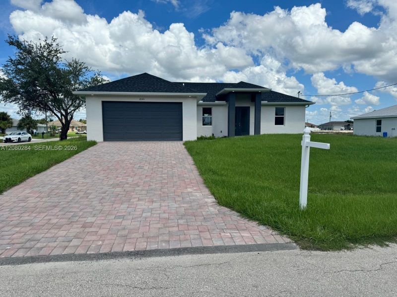 Front exterior of a new home in , Lehigh Acres, FL, highlighting curb appeal (Image 1). Front exterior of a new home in , Lehigh Acres, FL, highlighting curb appeal (Image 1).