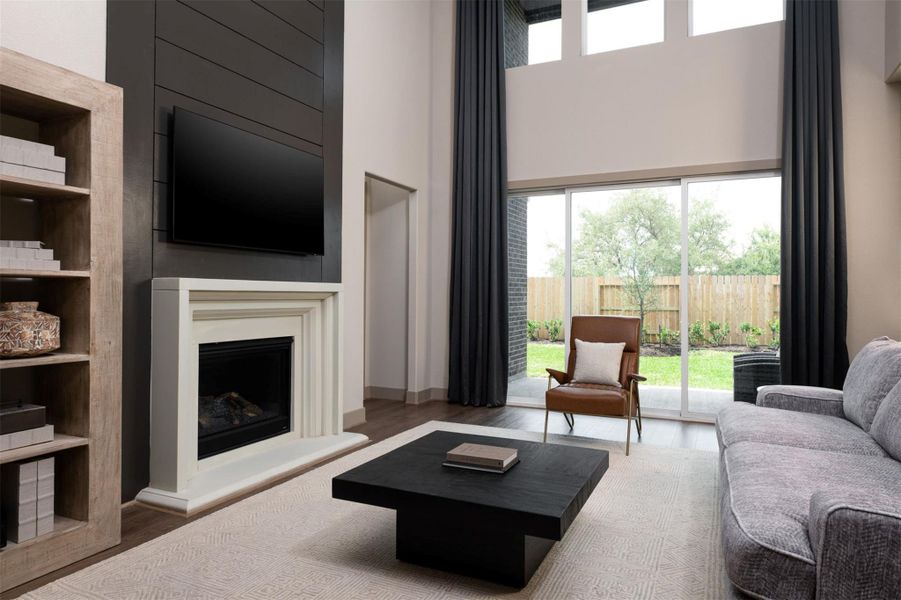 Your family room has ample space to entertain family and friends. This space features beautiful floors, fresh paint, ceiling fan with lighting, and high ceilings.