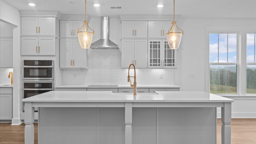 Notable 9-foot island provides generous prep and gathering space in this thoughtfully designed kitchen