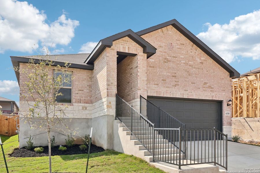 Front exterior of a new home in Comanche Ridge, San Antonio, TX, highlighting curb appeal (Image 28).