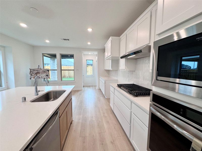 A 36" 5 burner gas cooktop with built in appliances to keep your kitchen looking fresh!