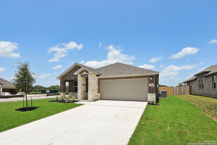 Front exterior of a new home in Carmel Ranch, Schertz, TX, highlighting curb appeal (Image 24). Front exterior of a new home in Carmel Ranch, Schertz, TX, highlighting curb appeal (Image 24).