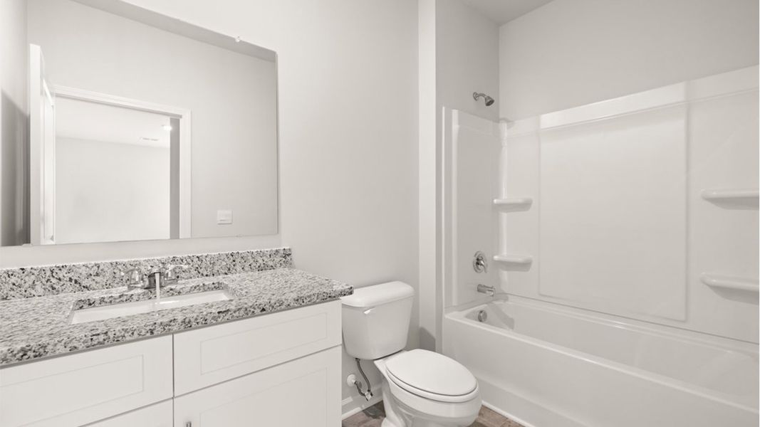 Representative furnished interior of a home built from the Mansfield by D.R. Horton in Highland Hills, Graniteville (Image 7).