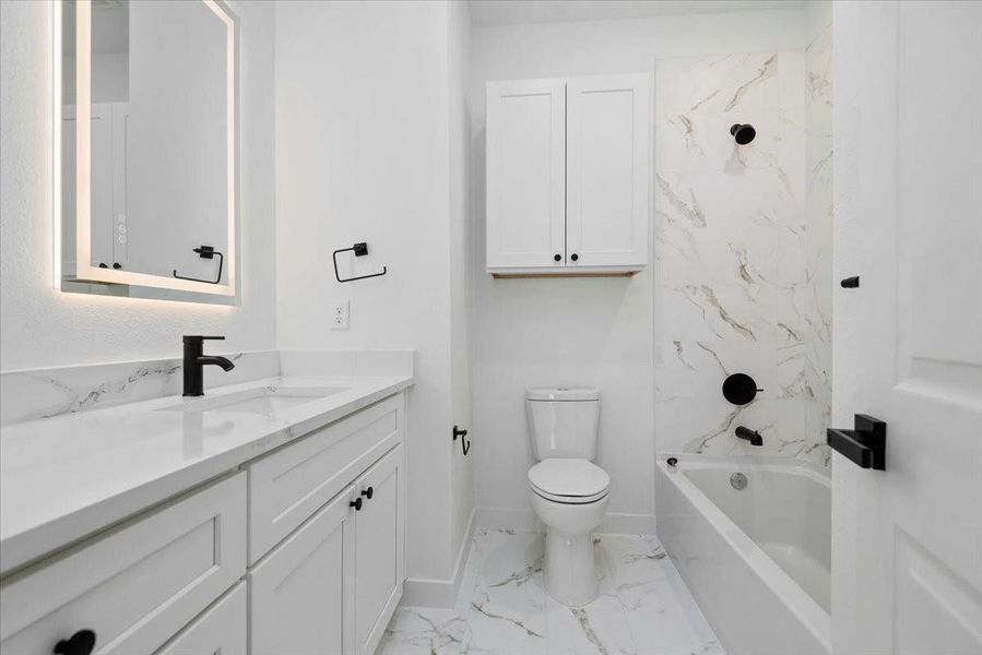 second bathroom features elegant modern finishes, creating a sleek and sophisticated setting second bathroom features elegant modern finishes, creating a sleek and sophisticated setting
