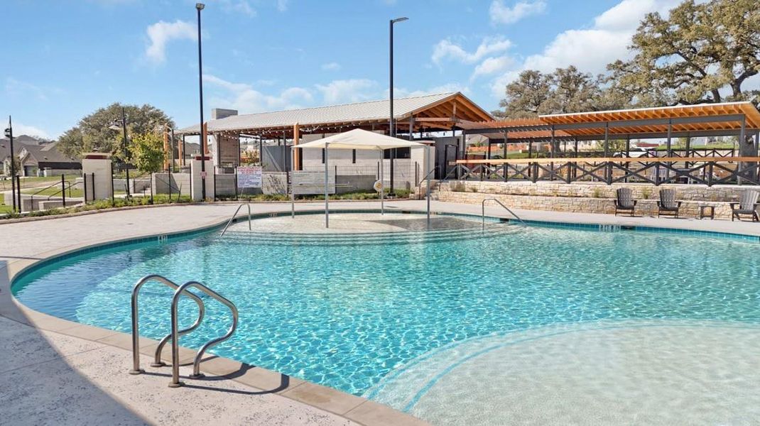 Community pool featuring a patio