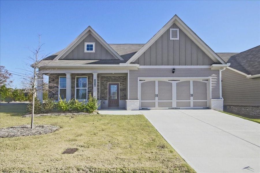 Front exterior of a new home in Cooper's Walk, Loganville, GA, highlighting curb appeal (Image 1). Front exterior of a new home in Cooper's Walk, Loganville, GA, highlighting curb appeal (Image 1).