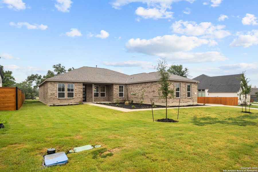 Front exterior of a new home in Potranco Oaks, Castroville, TX, highlighting curb appeal (Image 22).