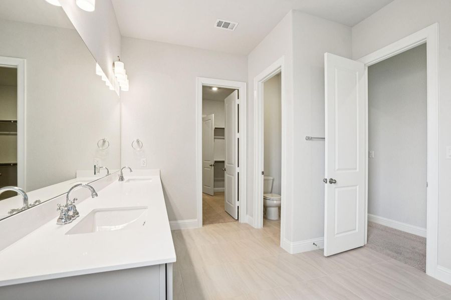 Furnished interior view inside a new home in Del Bello Lakes 60', Manvel (Image 18).