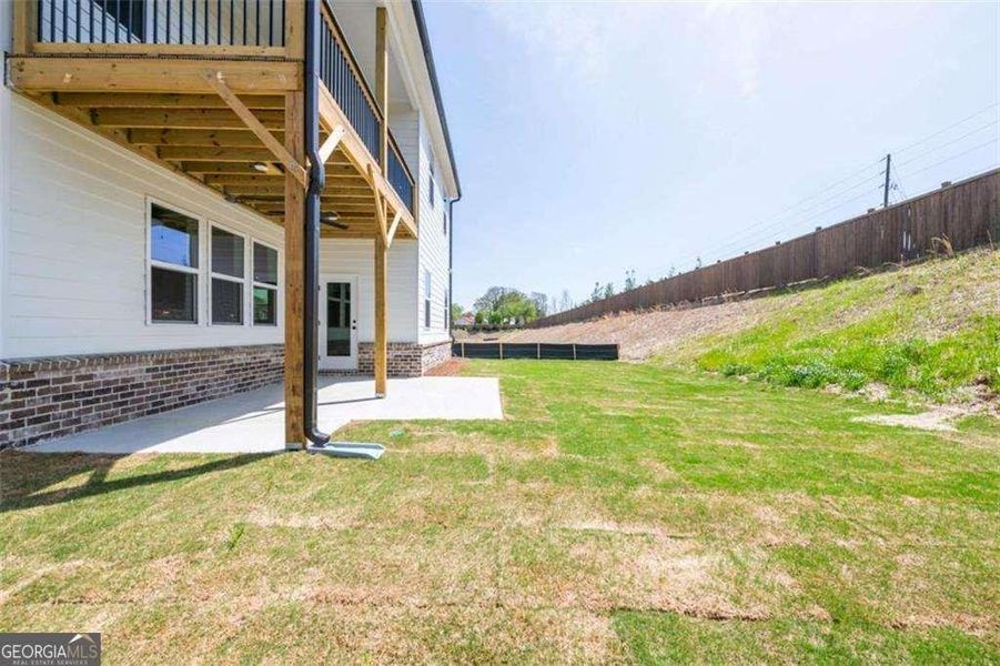 Exterior details and patio area of a home in The Paddocks at Doc Hughes, Buford (Image 3).