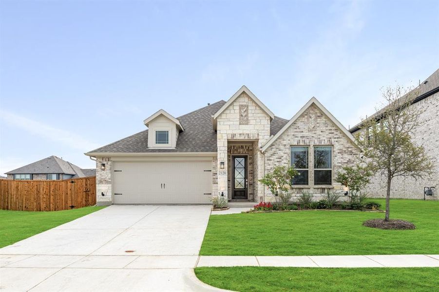 Front exterior of a new home in ArrowBrooke Classic 50, Aubrey, TX, highlighting curb appeal (Image 1).
