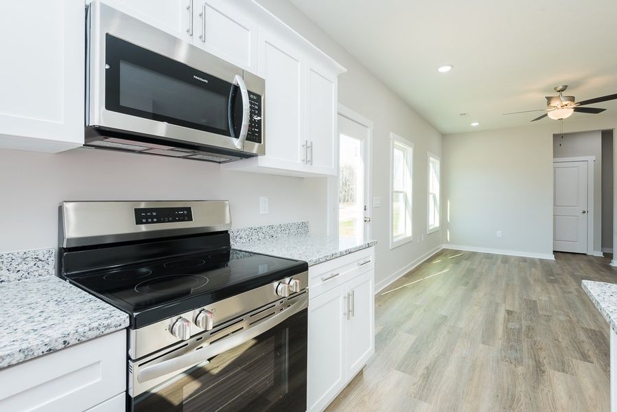 Furnished interior view inside a new home in Pallini Place, Elon (Image 7).
