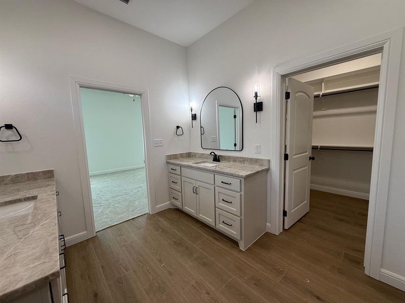 Full bath featuring two vanities