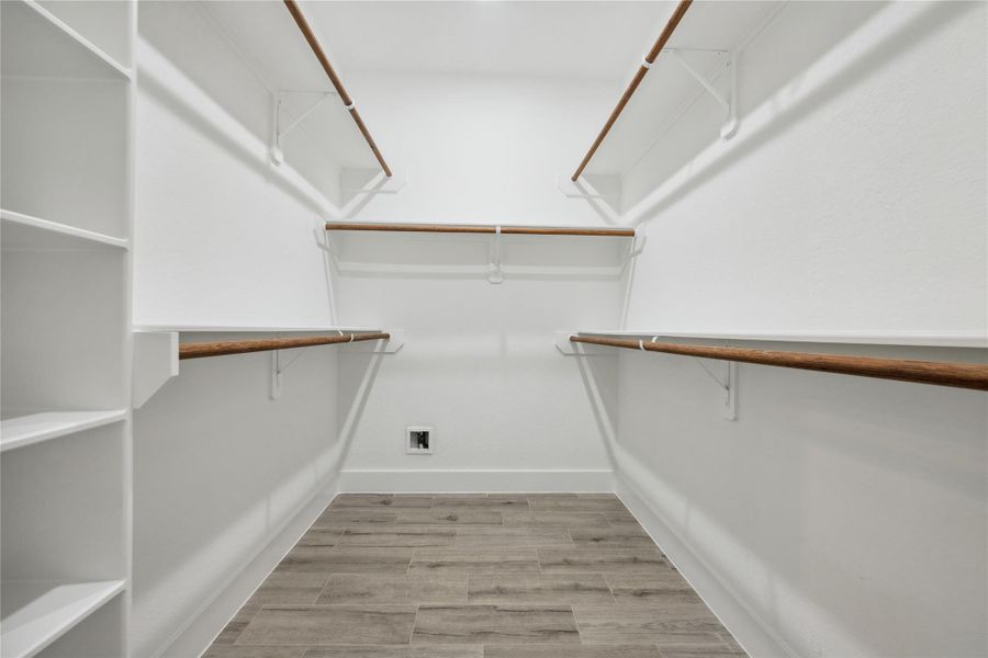 Primary closet with built ins.